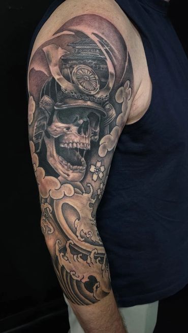 Detailed black and grey samurai skull and shading crafted by Coty