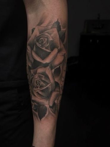 Custom black and grey realism rose forearm tattoo by Coty at Mayhem Tattoo in Salem, NH