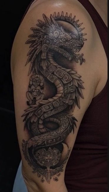 Custom black and grey Aztec and Mayan warrior sleeve tattoo by Coty at Mayhem Tattoo