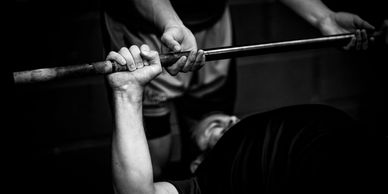 One of the CommandoFit Bristol members practicing bench press.