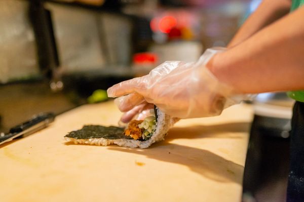 a person making sushi