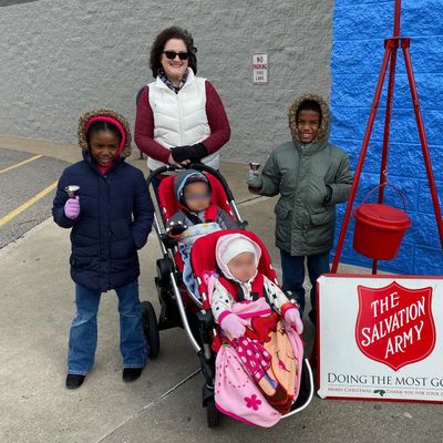 Photo of Kathleen Paydo with group of Foster Children at The Salvation Army.