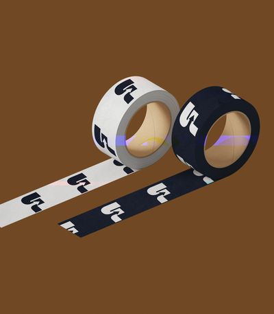 Two rolls of tape, one white and one black, both featuring a bold black and white logo pattern.