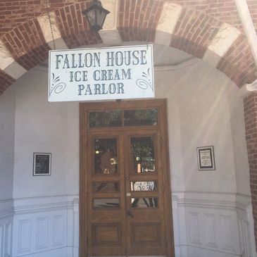 Entrance of Fallon House Ice Cream Parlor with wooden door.
