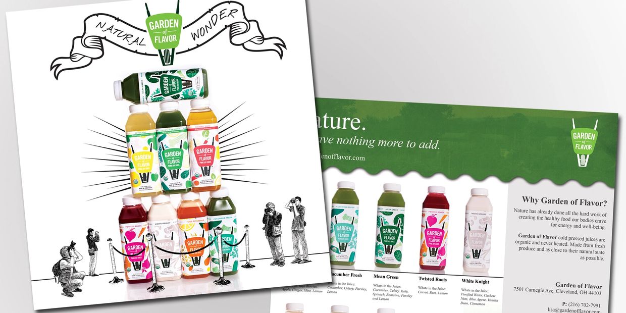A pyramid of Garden of Flavor juice bottles with photographers capturing the scene.