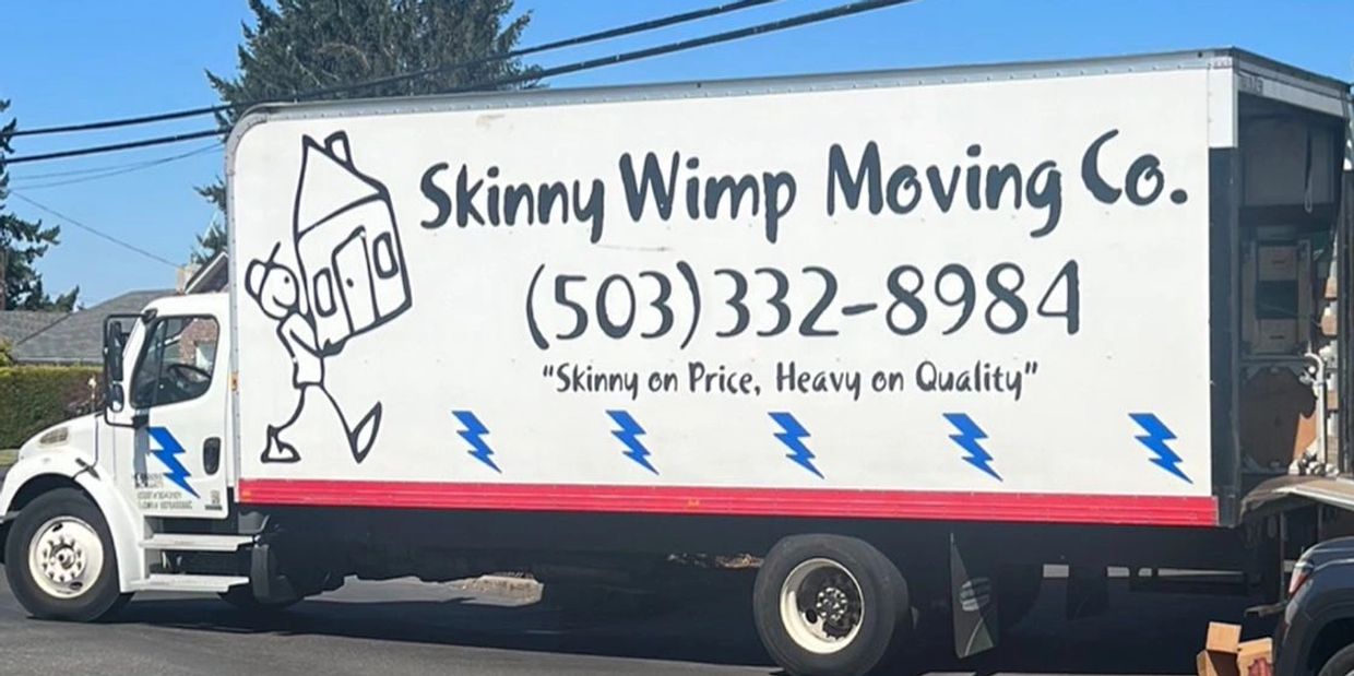A moving truck for Skinny Wimp Moving Co. with a cartoon logo and contact number.