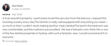 Positive Airbnb review praising sea view, kitchen, and comfort.