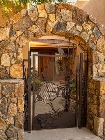 Custom Southwestern steel courtyard gate handcrafted by Tin Works with desert-inspired artistry