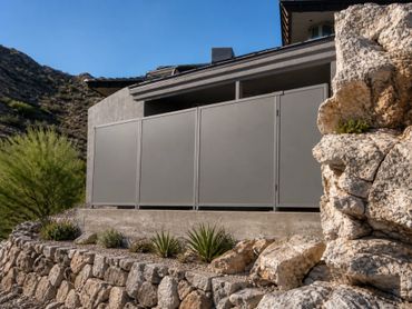 Custom powder coated steel equipment enclosure designed for clean, modern outdoor living spaces