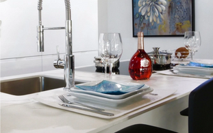 Quartz countertop island in modern style kitchen.