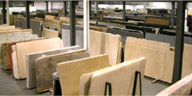 Granite countertop slabs in warehouse.
