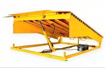 A yellow hydraulic dock leveler for loading and unloading.