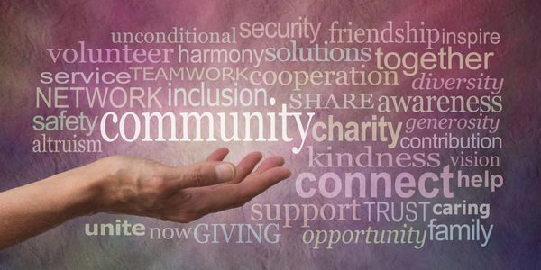 Hand reaching out amid words about community, kindness, and support.