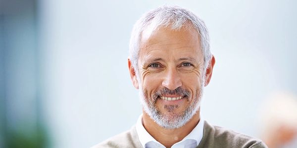 Smiling grey haired gentleman