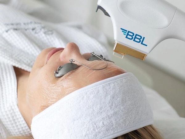 woman in white robe with headband