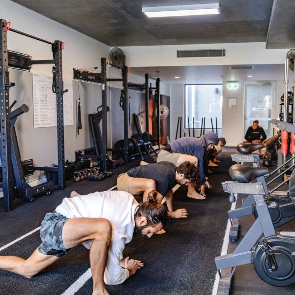 Group stretching exercise in a gym.