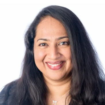 Smiling woman with long hair.