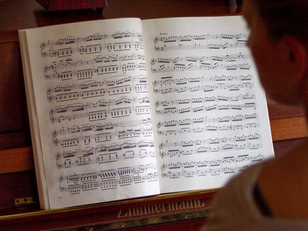 Piano teacher reading musical notes; Suzuki piano method; piano teacher; North London; piano lessons