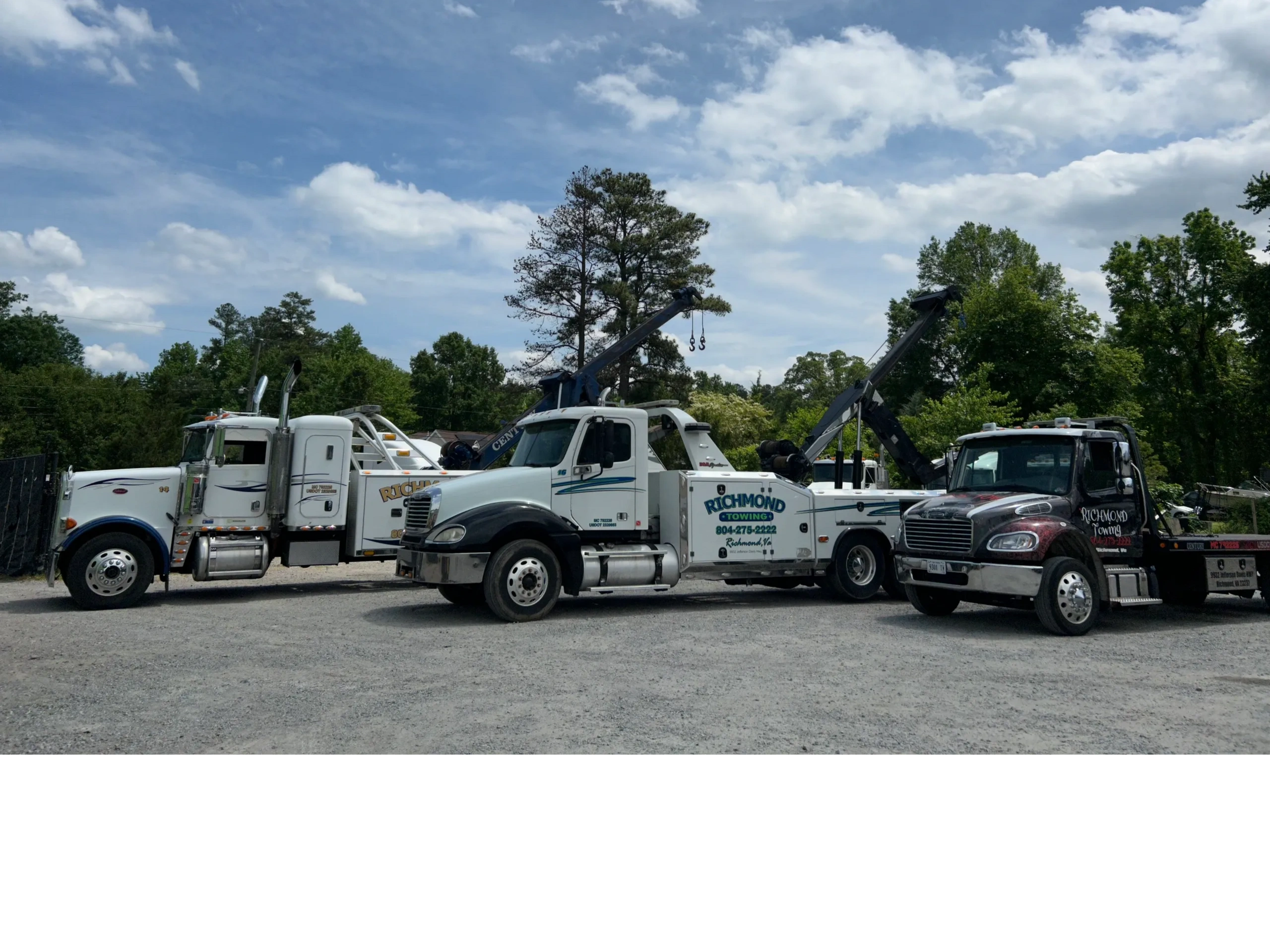 A line of several large and medium tow trucks