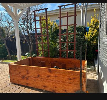 Custom redwood planter box on wheels.