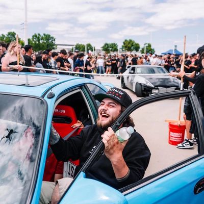 One Stop owner Camdyn laughing with joy at a car show