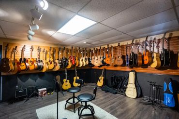 music store with instruments, guitars, more