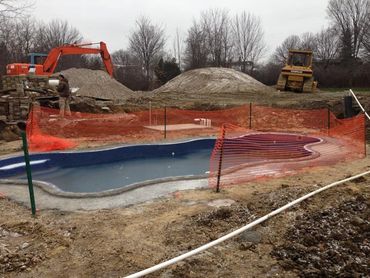 Custom shaped swimming pool. Inground pool. Custom cement pool