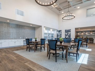 Community kitchen and dining area at Palladium Garland Senior Living, an example of the spaces plann