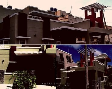 Modern house exterior with geometric design and red vertical accents.