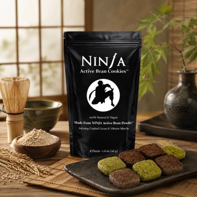 Black package of Ninja Active Bran Cookies with green and brown cookies on a plate.