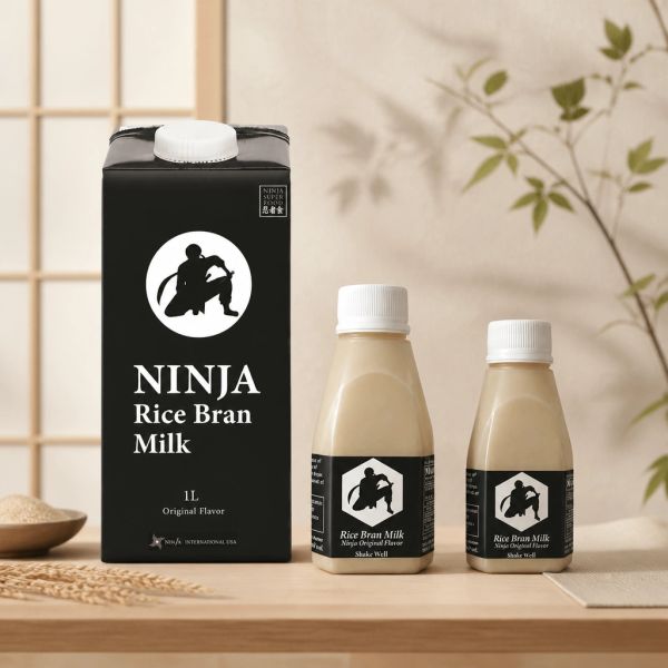Ninja Rice Bran Milk packaging with a black carton and two small bottles on a wooden surface.