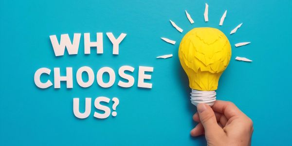 Hand holding yellow light bulb with 'WHY CHOOSE US?' text.