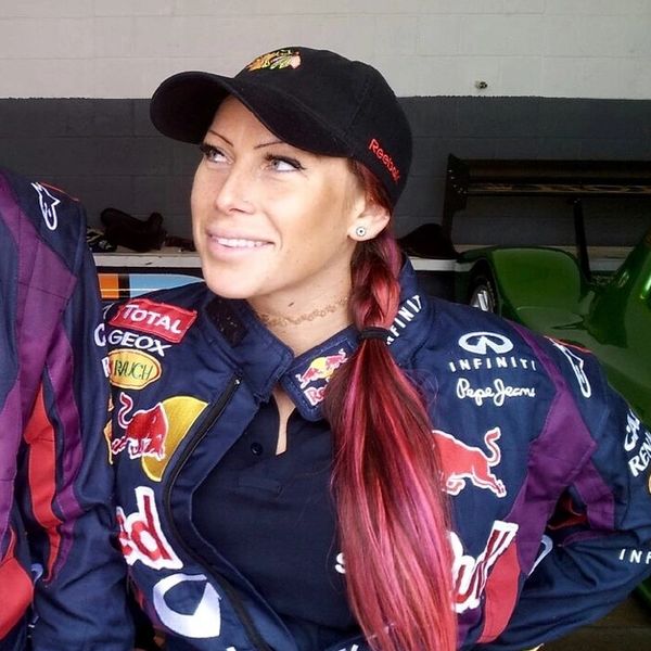 A very beautiful girl in a Red Bull racing suit