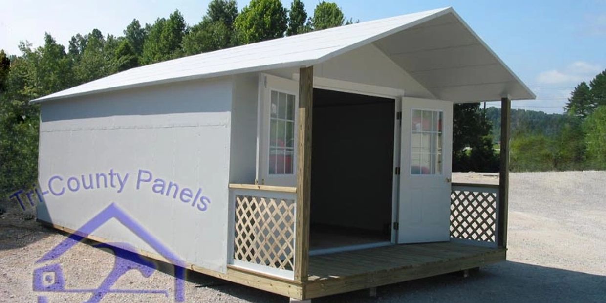 White outdoor shed with double doors and porch.