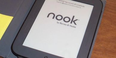 A Barnes and Noble Nook device sitting on a table