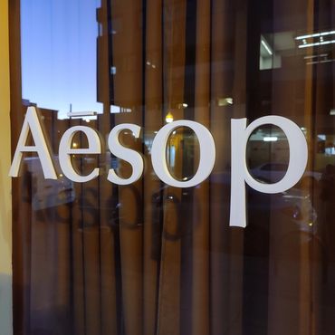 CNC Zund cut pvc with adhesive to apply as a logo to Aesop windows.