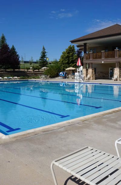 Empty outdoor swimming pool on a sunny day.