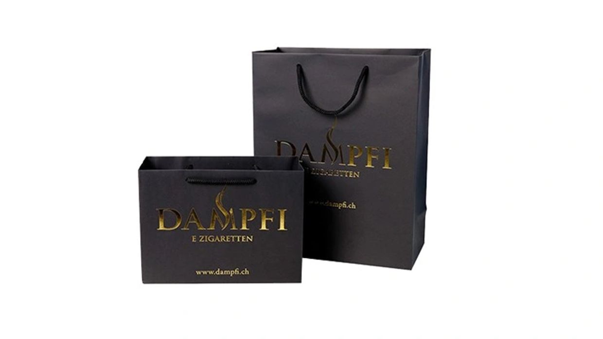 Premium Paper Carry Bag with eye-catching branding. Gold foil printing and matte coated finish.