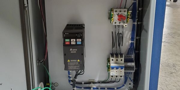Electrical control panel with wiring and components.