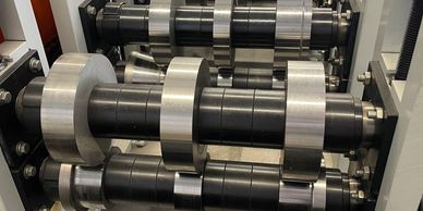 Close-up of a mechanical roller system.