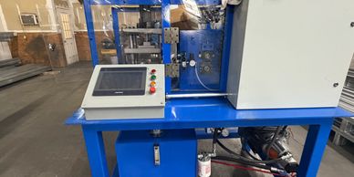Industrial machine with control panel in factory setting.