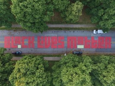 Black lives matter street art patterson park baltimore newspaper feature painting resident local art