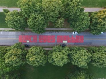 Black lives matter street art patterson park baltimore newspaper feature painting resident local arts