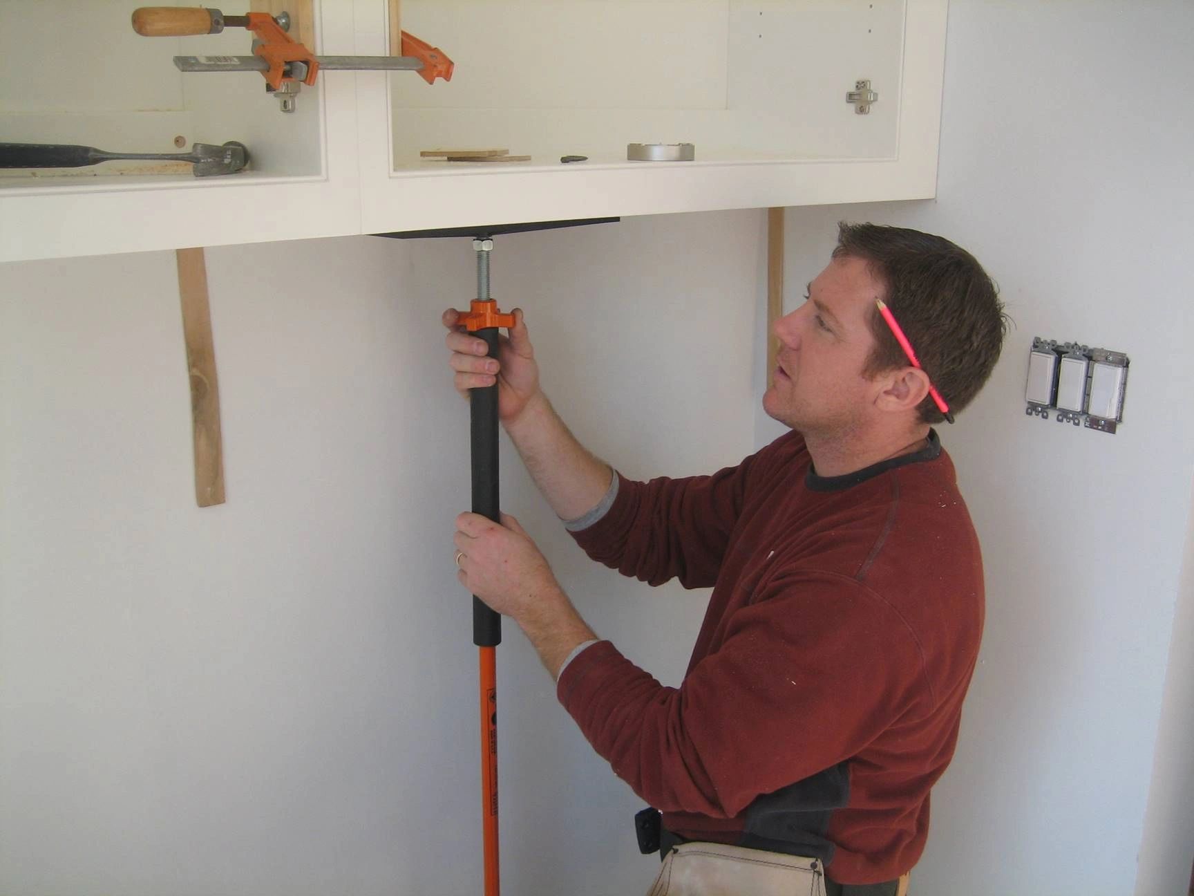 Installing frameless cabinets using the T-Jak 