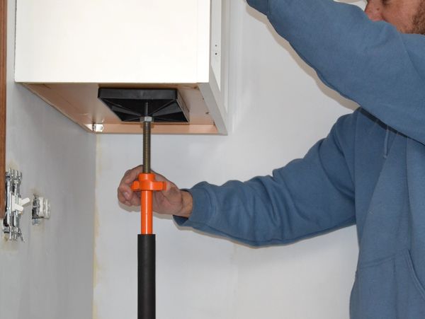 The  T-JAK® kitchen cabinet installation jack allows you to install kitchen cabinets alone