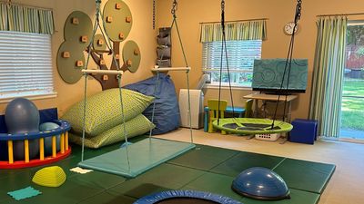 A sensory playroom with swings, jumping, climbing and cozy spaces let children explore and play.