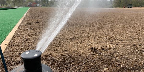 New irrigation sprinkler system on a farm field