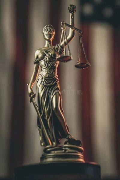 Statue of Lady Justice holding scales and sword.