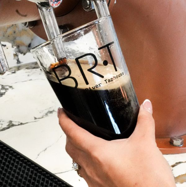 Pouring dark beer into a BRT glass.