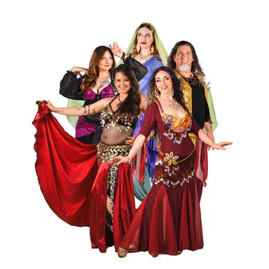 Group of five people in colorful belly dance costumes posing.